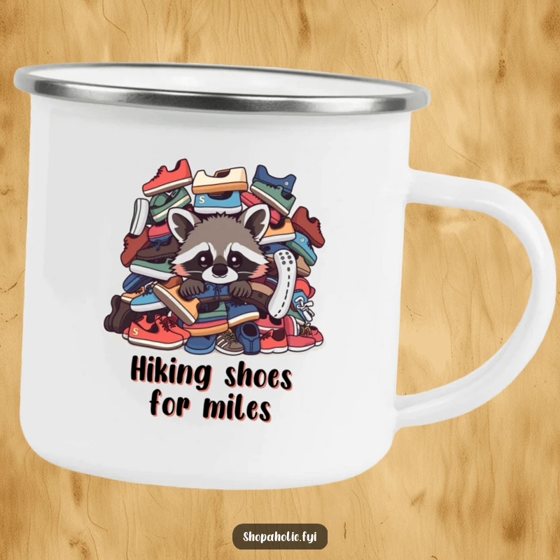 Funny Raccoon Camping Mug: A curious raccoon peeks from behind shoes on this enamel mug, ideal for outdoor fun.
