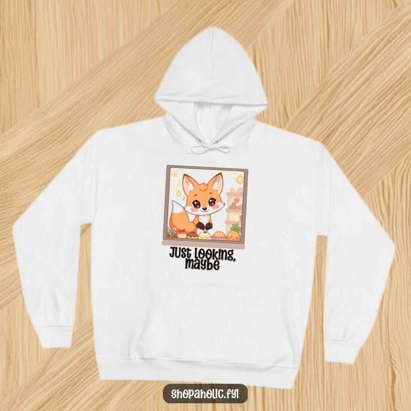 Funny Hoodie: A fox with enormous, captivated eyes peers longingly at a window full of delectable goodies, exuding cozy humor.