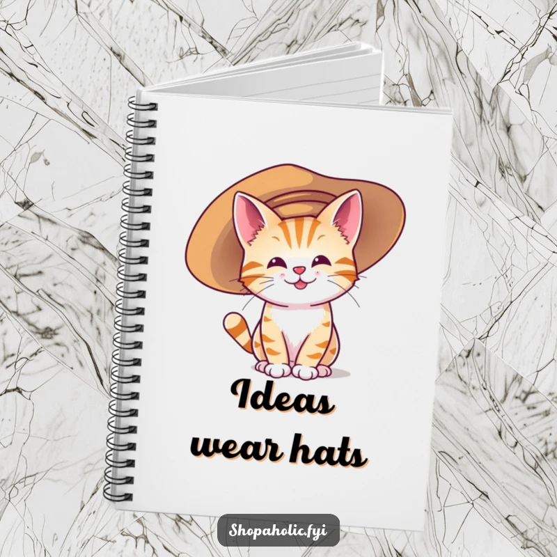 Funny notebook with a happy cat character trying on a large, oversized hat, symbolizing creative and humorous expression.